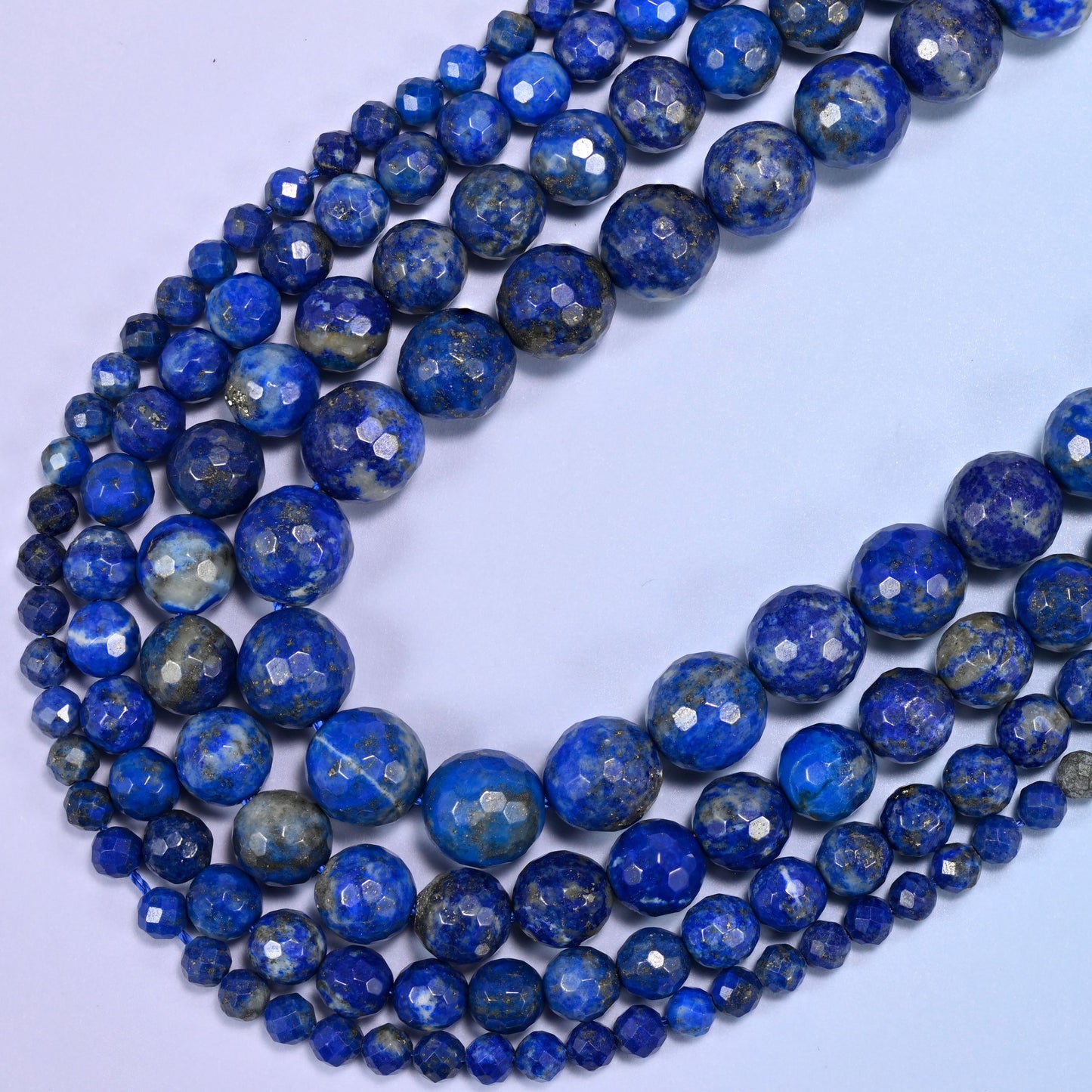 Lapis Lazuli Faceted Round Beads, sold per 15 inch strand.
