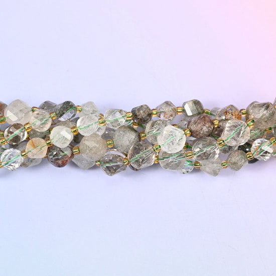 Green Phantom Quartz Faceted Spiral Twist Beads, clear to milky quartz with mossy green and rust-brown phantom inclusions