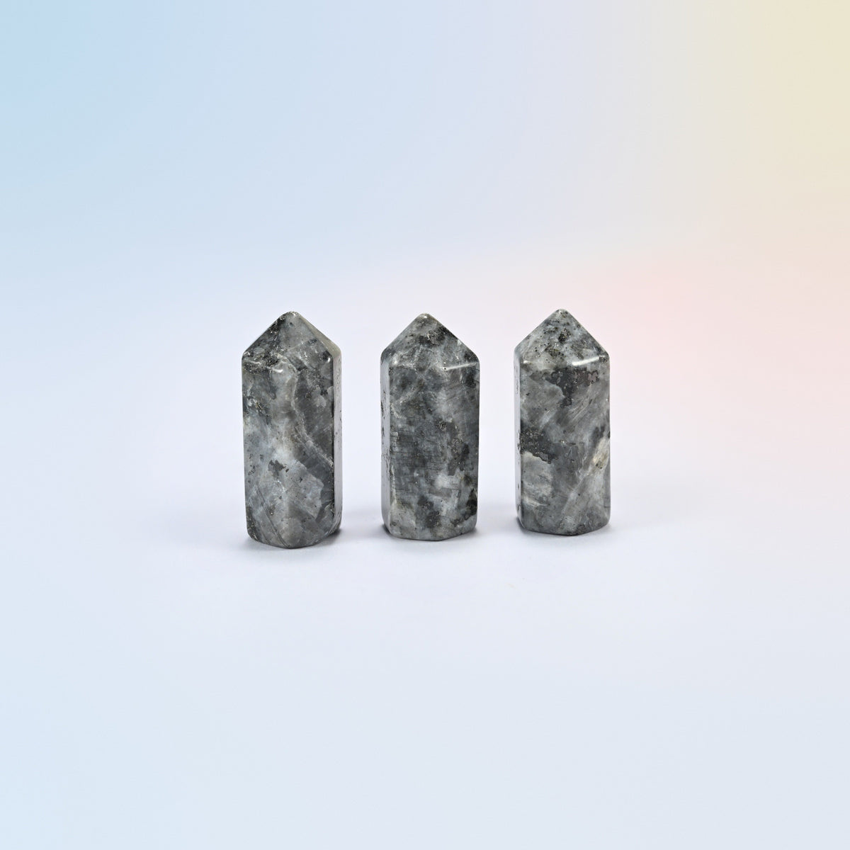Three natural black labradorite small hexagon crystal points, gray and black