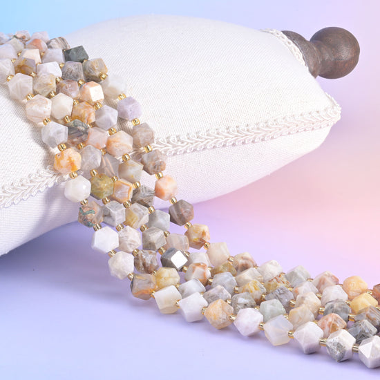 Faceted rhombus beads, centre-drilled, hole approximately 1.0mm with a +/- 0.2mm difference.