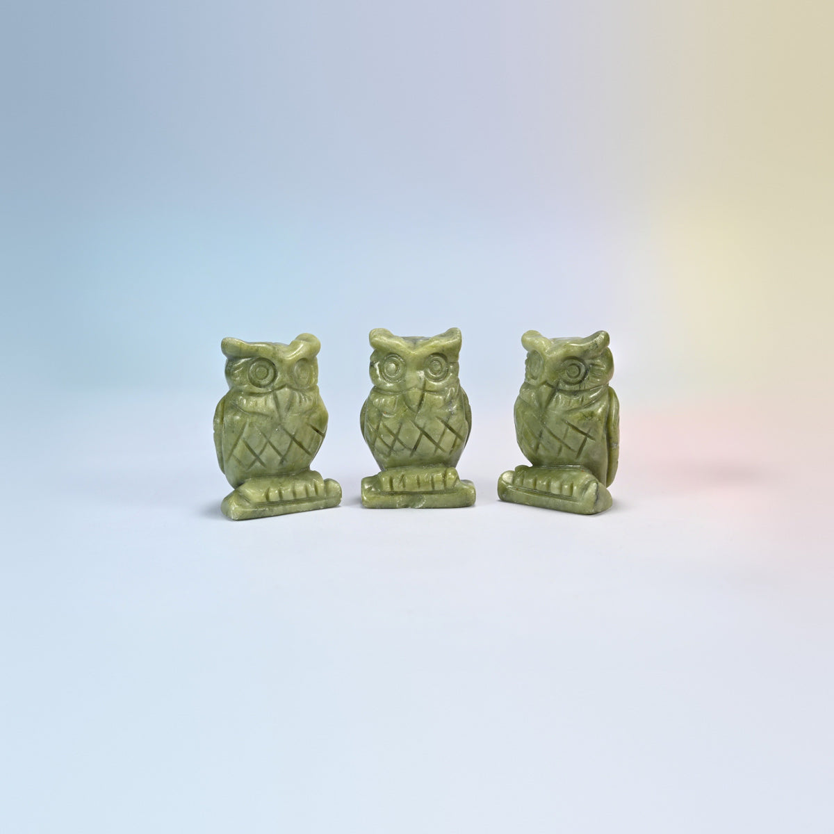 Owl crystal carving in south green jade, olive green natural stone