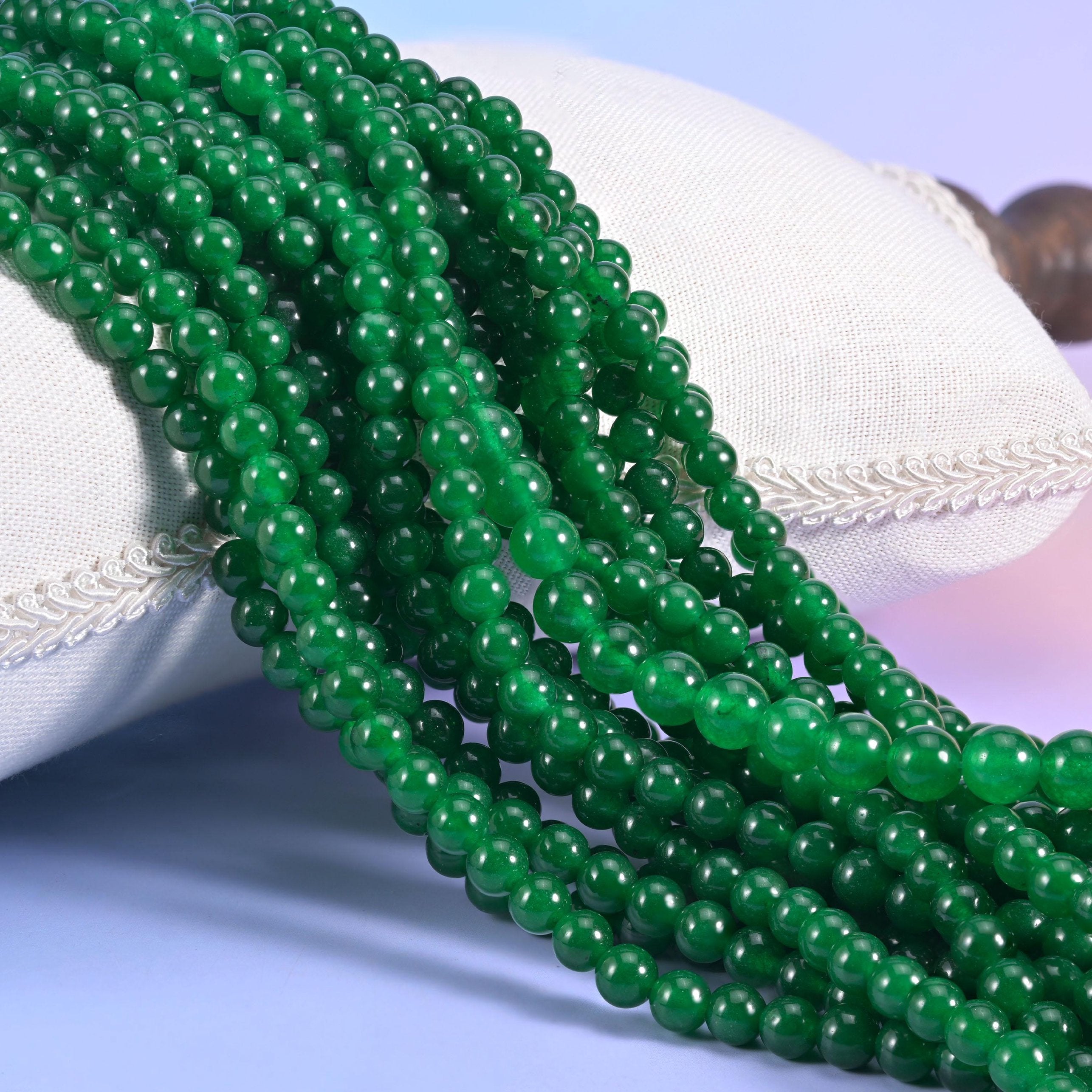 Green Dyed Jade Smooth Round Beads, strong even emerald green with a glassy polish