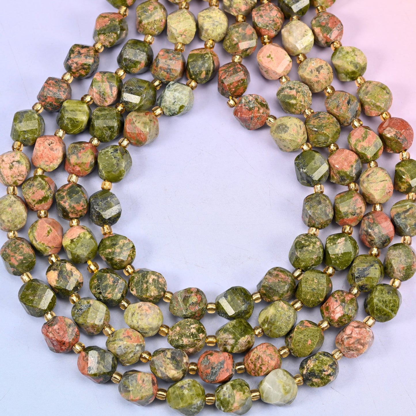 Unakite faceted spiral twist beads, approximately 31 beads per 15 inch strand