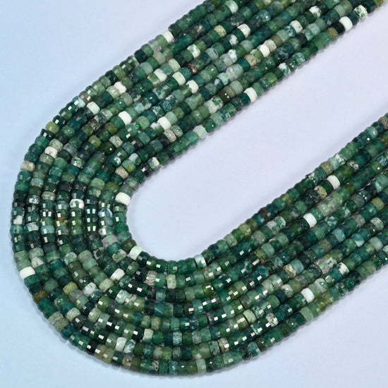 Moss agate faceted heishi disc beads in several strands curved into a wide U, deep green stone with white patches