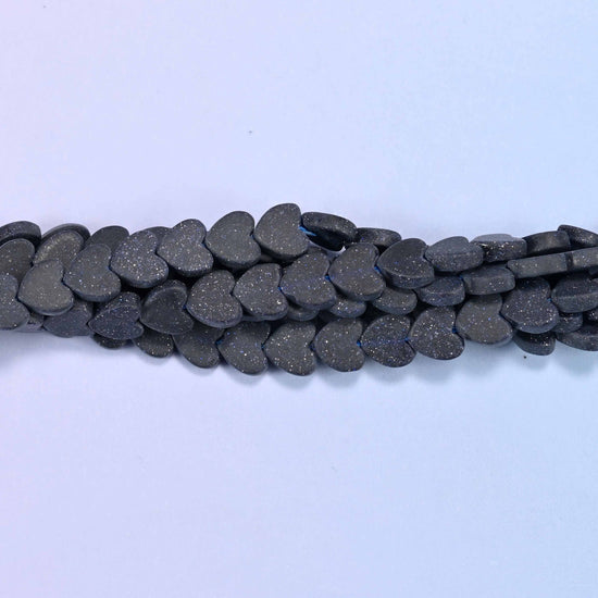 Matte Blue Sandstone Flat Heart Beads, approximately 68 beads per strand