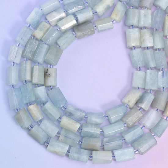 Blue Aquamarine Faceted Tube Beads, approximately 29 beads per strand