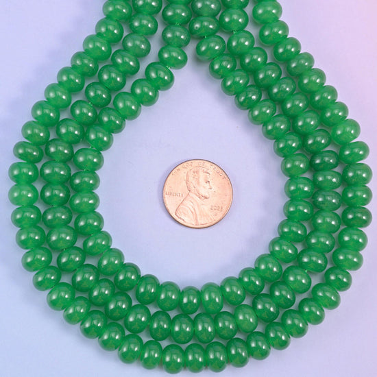 Green Dyed Jade smooth rondelle beads in a vivid emerald green, finished with a smooth, polished surface