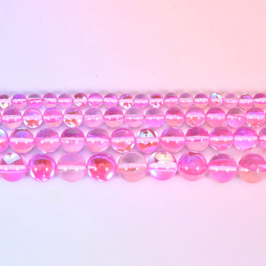 Mystic Aura beads in bubblegum-pink iridescent glass with lilac and gold shifts