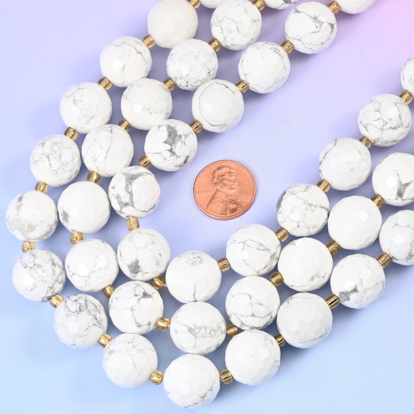 White Howlite Faceted Round Beads, chalky bright white crossed by fine grey-charcoal marbled veining