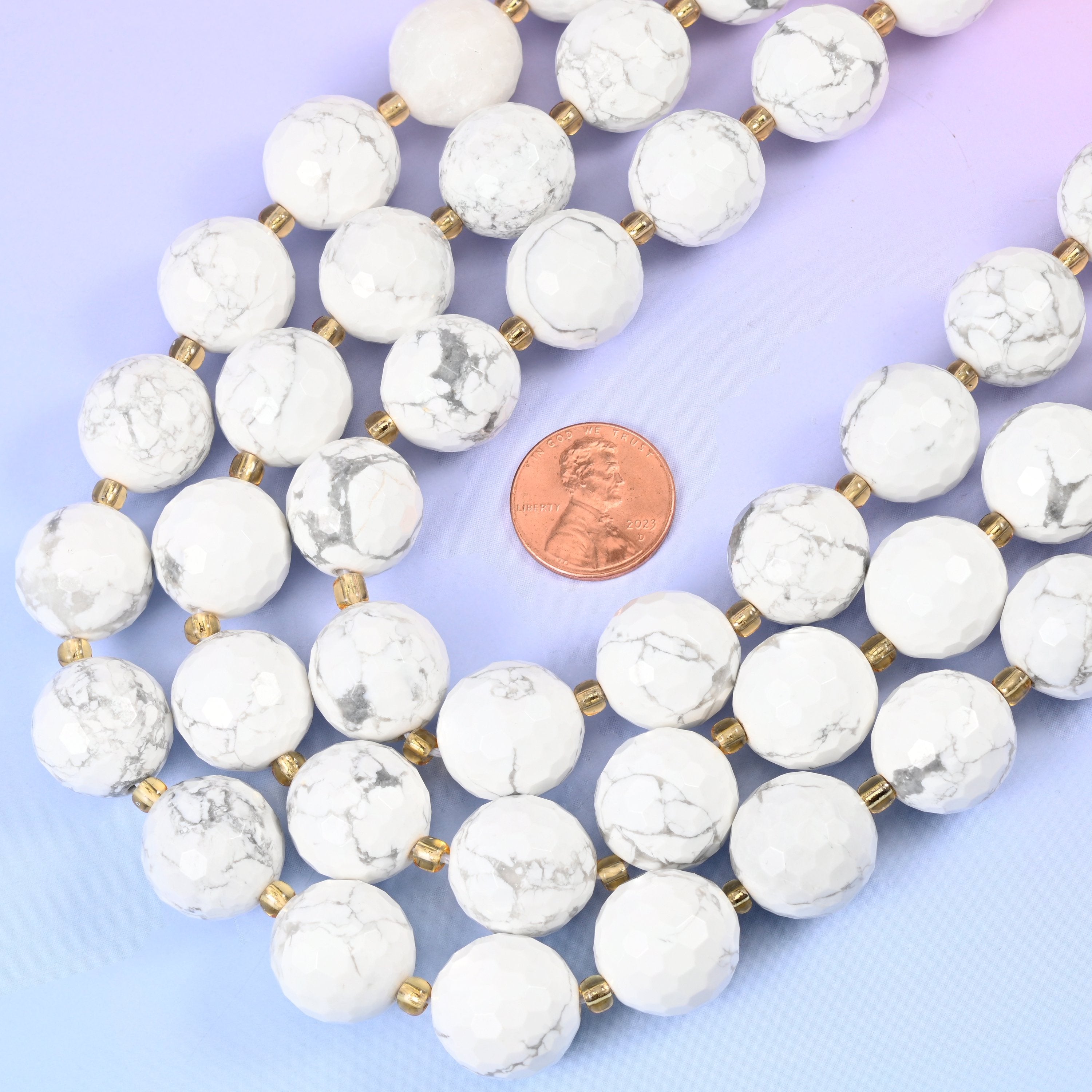 White Howlite Faceted Round Beads, chalky bright white crossed by fine grey-charcoal marbled veining