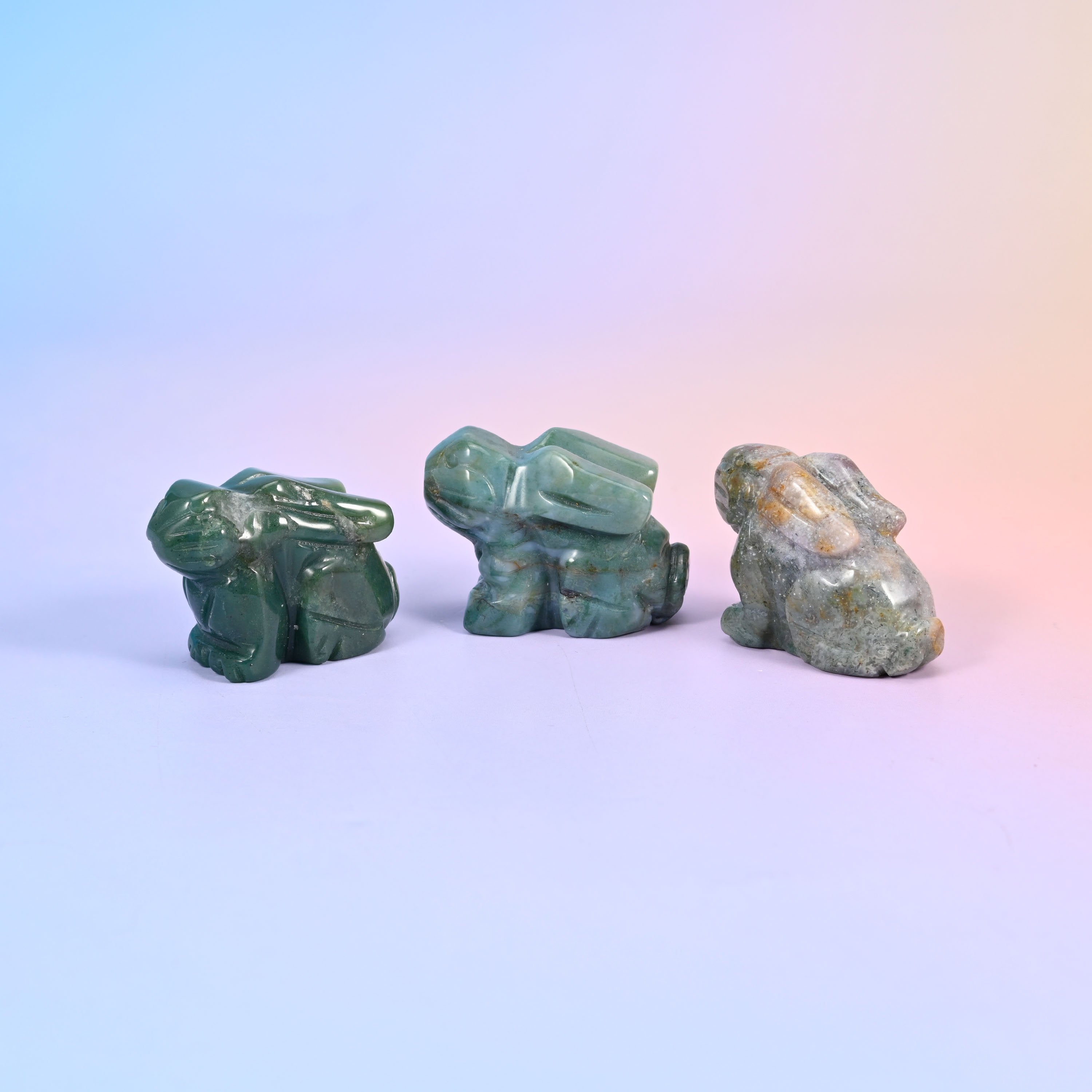 Laying down bunny carving offered in 47 gemstones, from deep green and cream to lilac, coral and blue