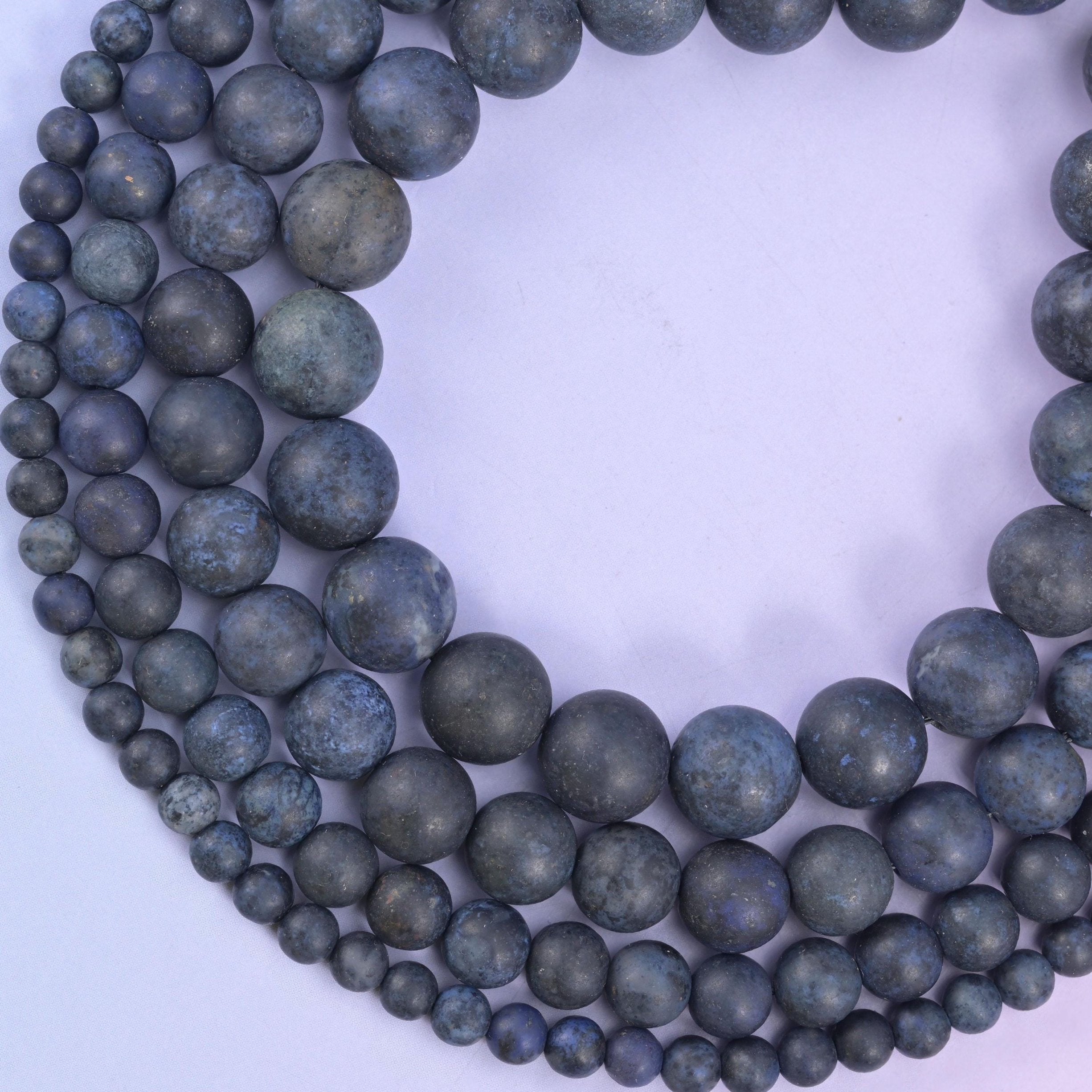 Dark blue dumortierite matte round beads, approximately 37 to 84 beads per strand depending on size