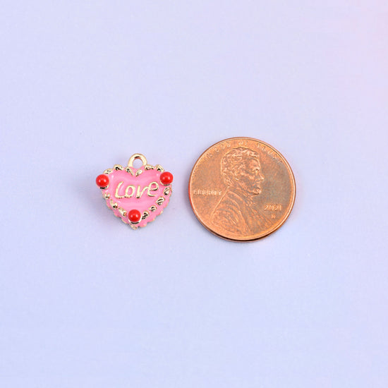 Single pink enamel heart charm at 13.55 x 13.10mm, heart charms small enough for earrings and bracelet links.
