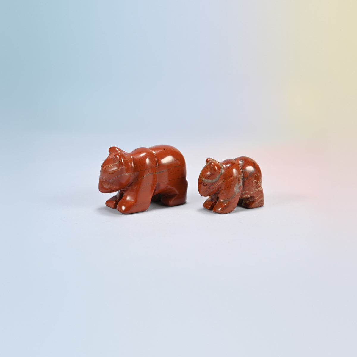 A 2 inch and a 1.5 inch red jasper bear crystal carving, brick red natural stone