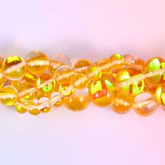 Mystic Aura Yellow Round Glass Beads, sold per 15 inch strand