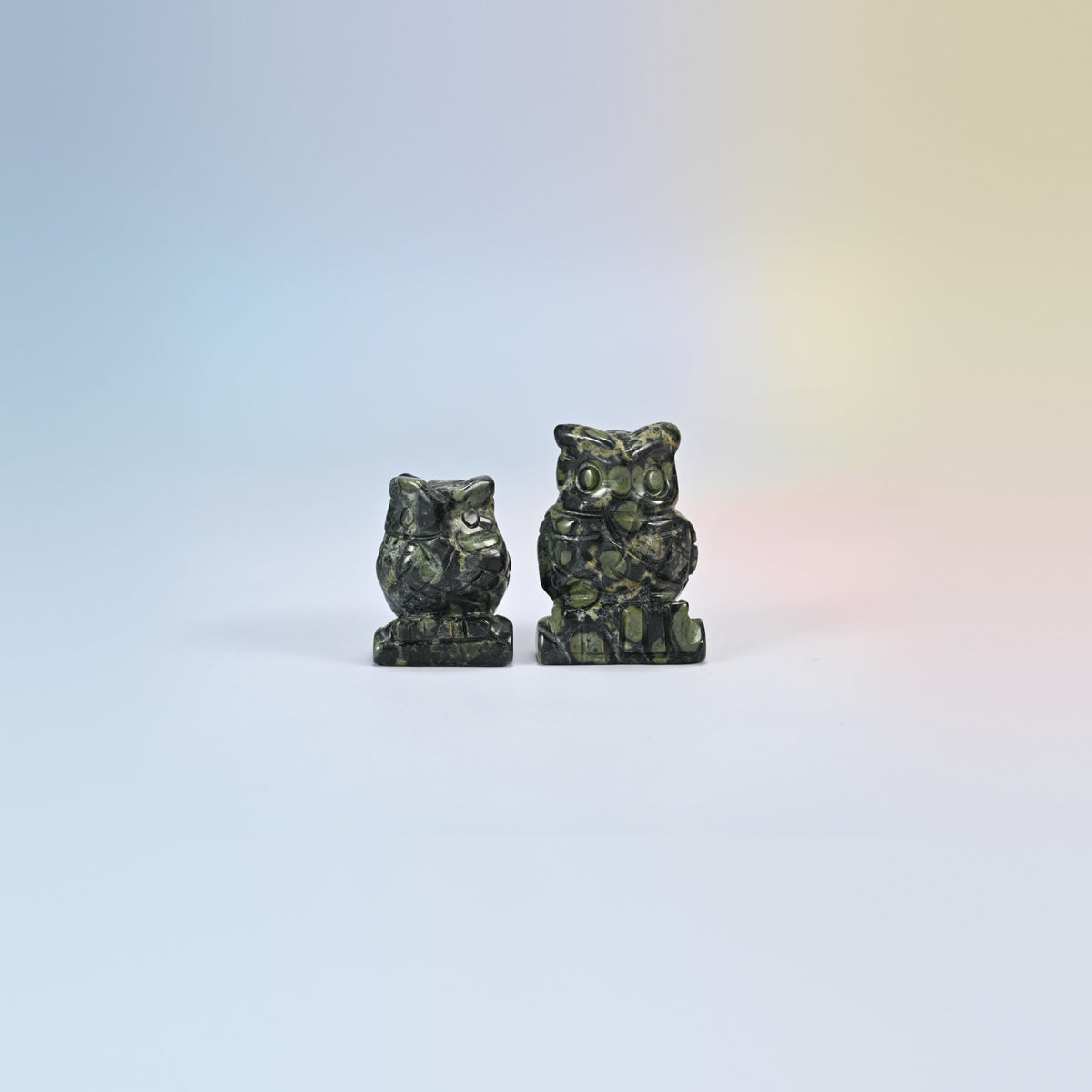 Owl crystal carving in kambaba jasper, dark green natural stone with black orb patterns
