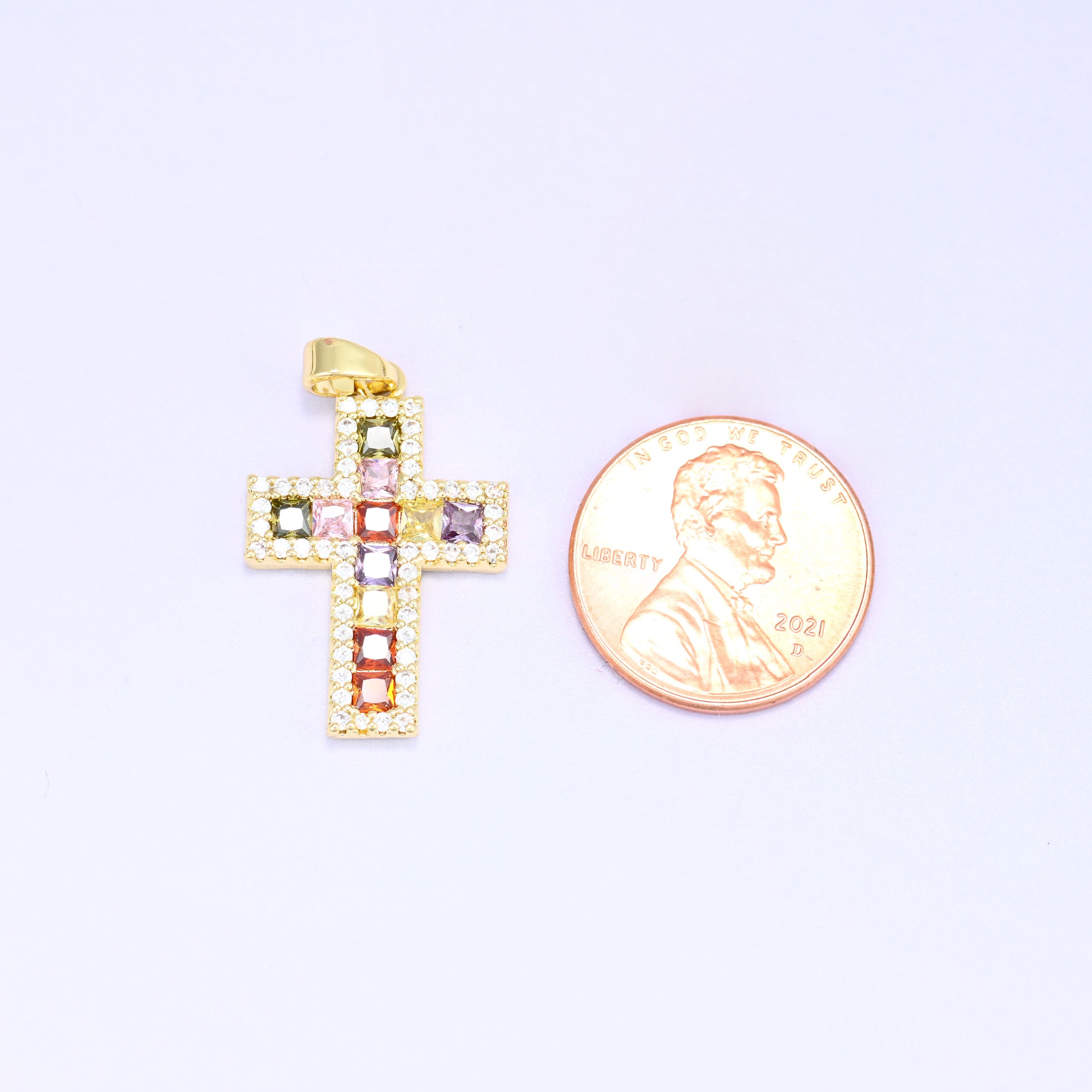 Zirconia cross charm in gold plated brass, shown at 24.15 x 16.29mm including the ring