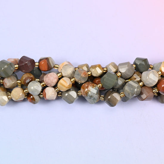 Sage grey, cream, camel and rust brown layered together like a cross-section of rock, cut so the facets spiral round the bead and each turn reveals a different band.