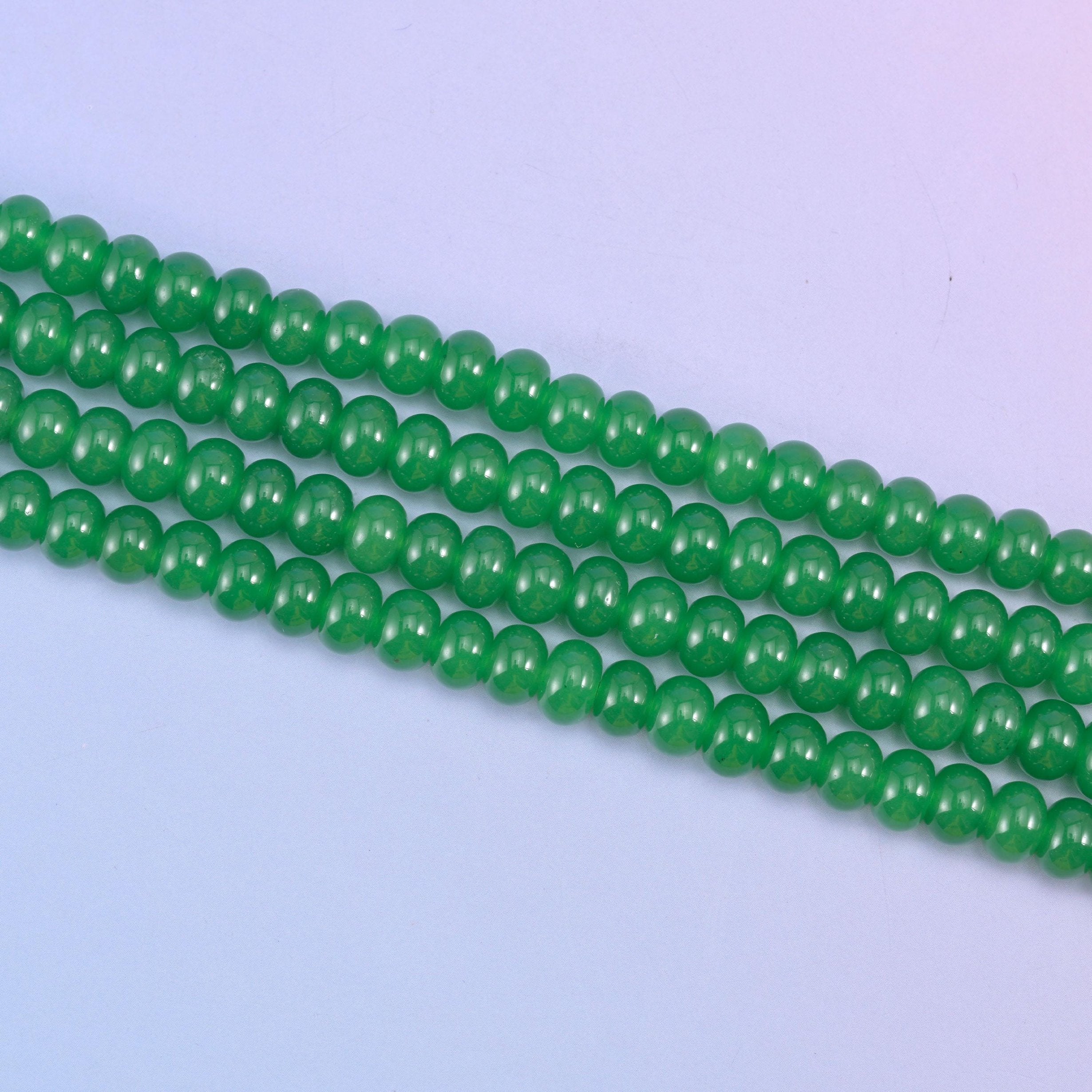 Green Dyed Jade beads in a vivid emerald green tone