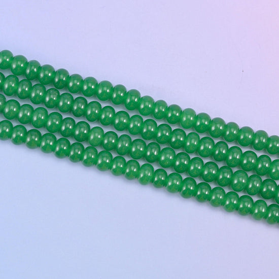 Green Dyed Jade beads in a vivid emerald green tone