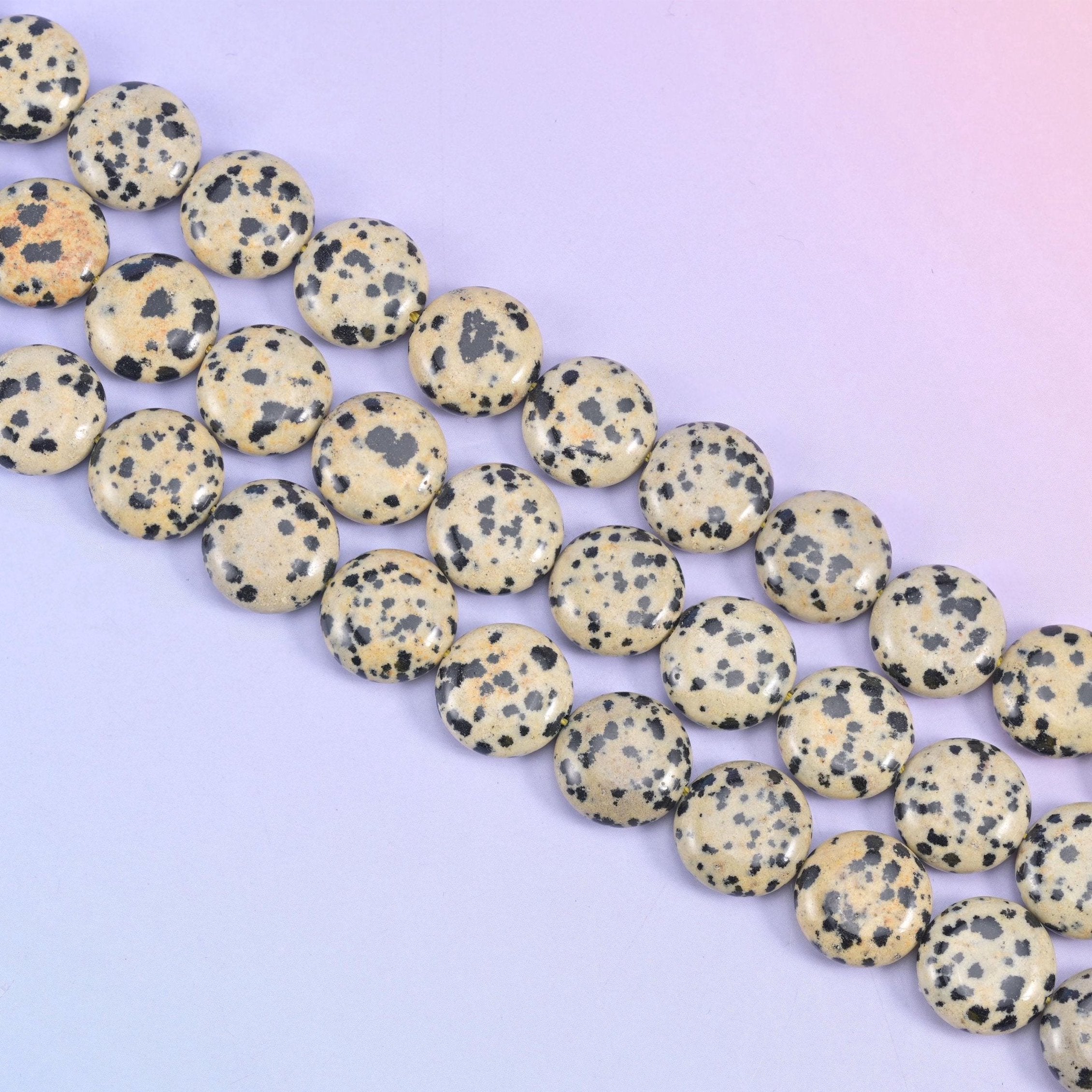 Dalmatian Jasper Smooth Coin Beads in oatmeal cream with inky black spots