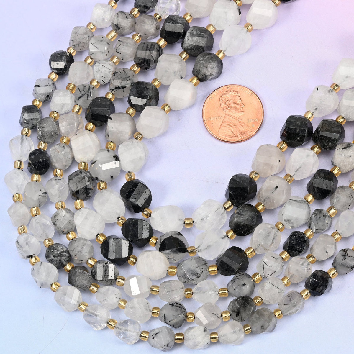 Faceted spiral twist cut black rutilated quartz beads