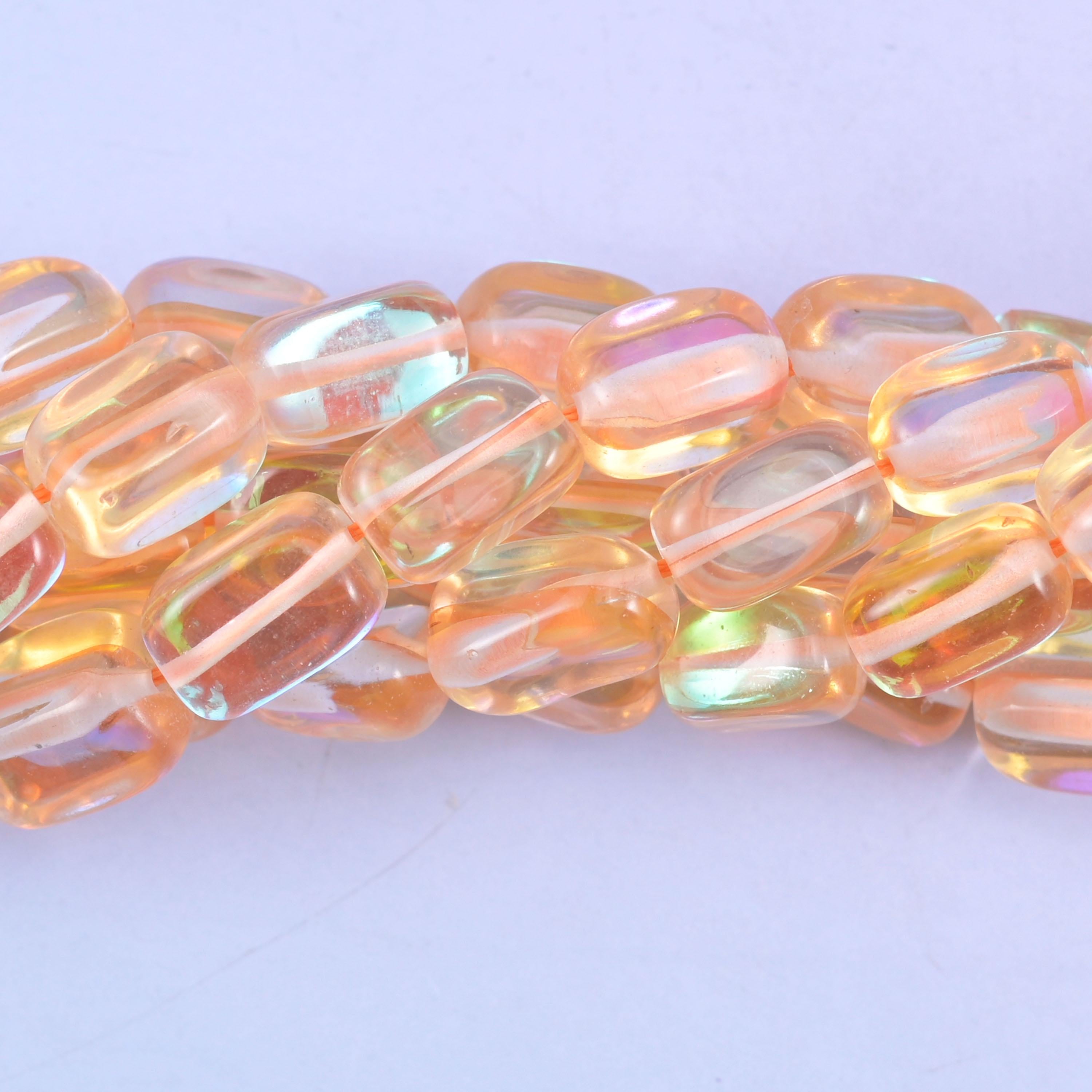 Rectangular cut glass beads with a glossy transparent finish and iridescent mystic aura coating