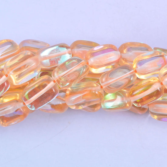 Rectangular cut glass beads with a glossy transparent finish and iridescent mystic aura coating