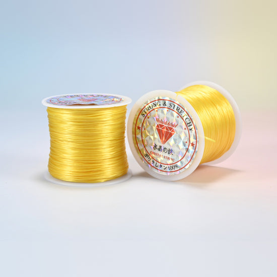Two rolls of yellow 0.7-0.8mm elastic stretch string, glossy polyurethane bead cord with a holographic label