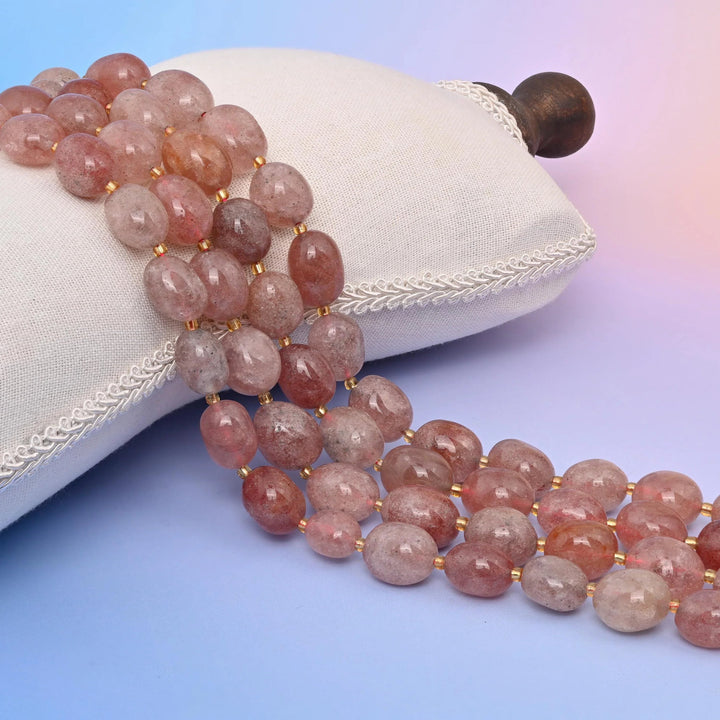 Natural Pink Strawberry Quartz oval nugget beads with a lovely pink translucence.