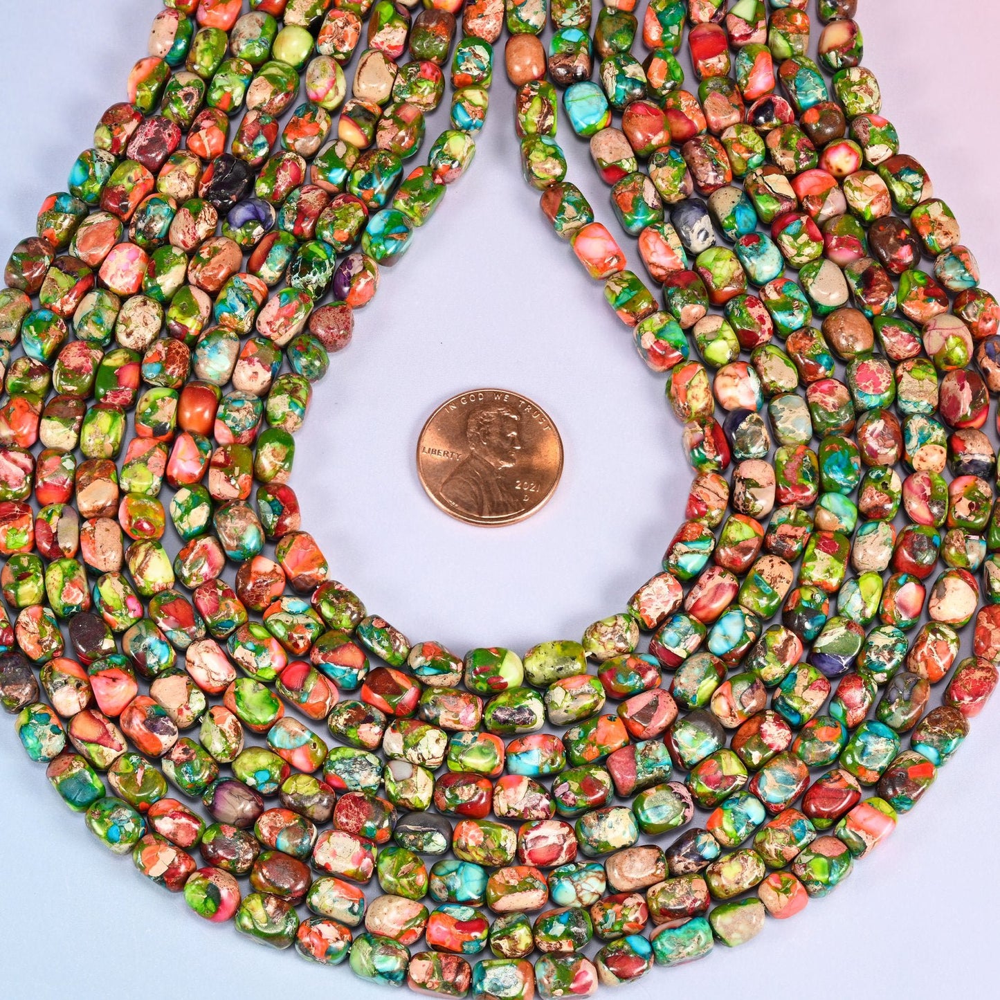 Small tumbled nuggets in dyed apple and moss green Sea Sediment Jasper, veined and blotched with brick red, turquoise, tan and cream