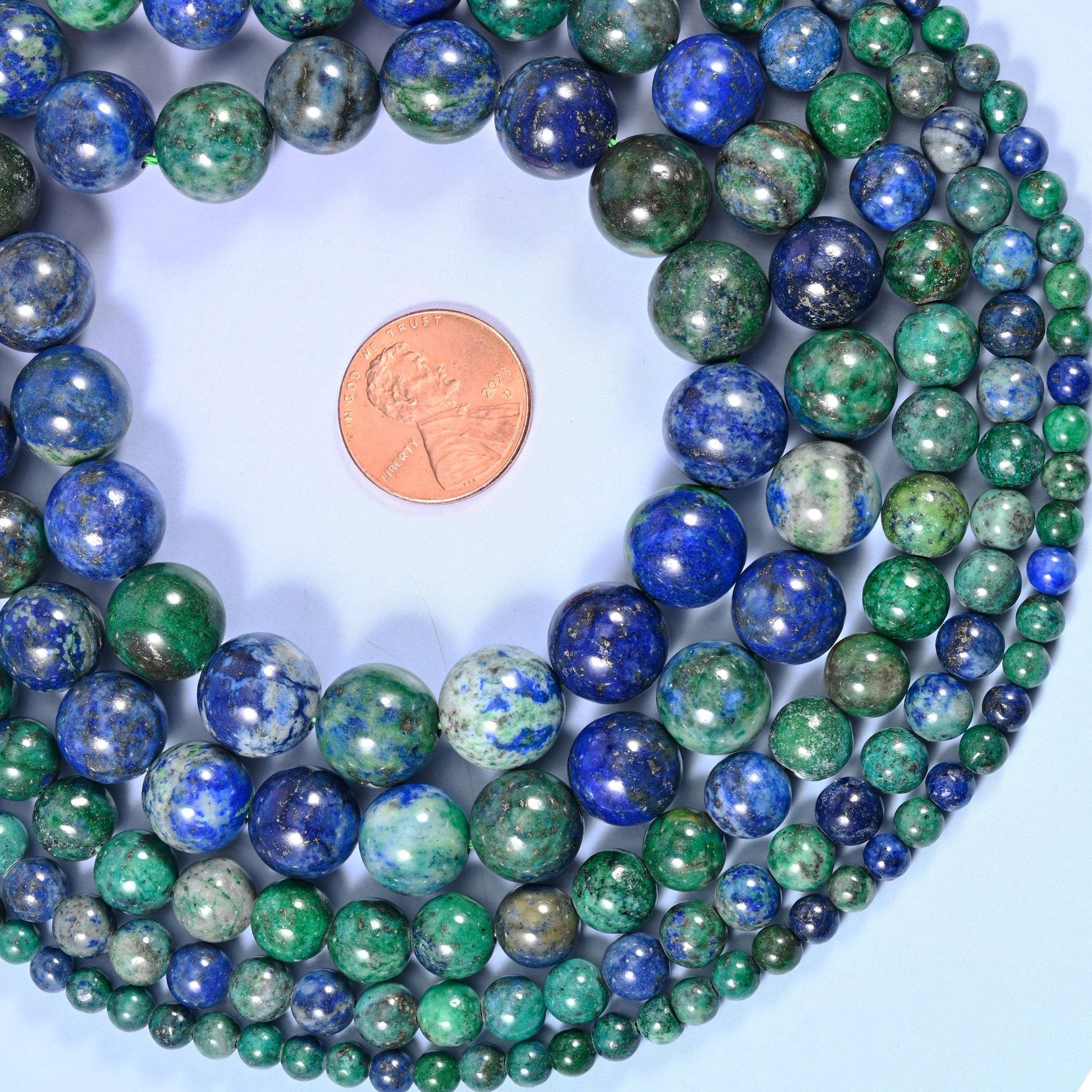 Phoenix Lapis Smooth Round Beads, sold per 15.5 inch strand