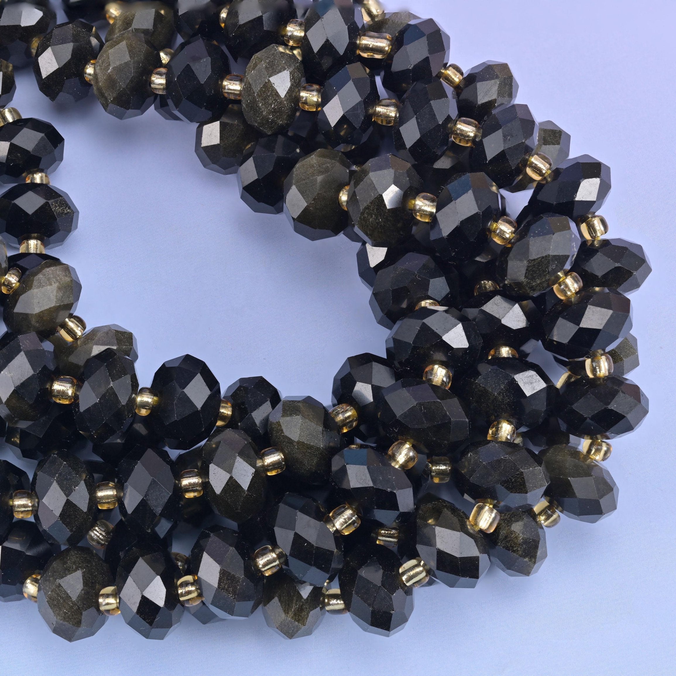 Faceted rondelle cut gold obsidian beads