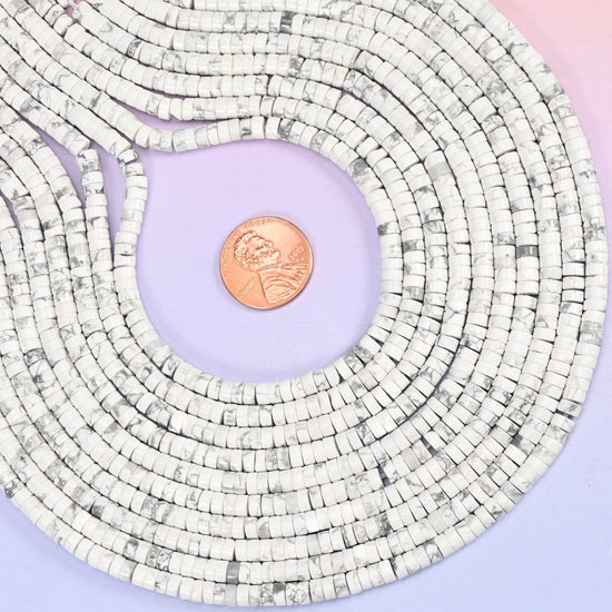 Natural White Howlite smooth heishi disc beads in classic white with characteristic gray veining, finished with a polished, sophisticated look.