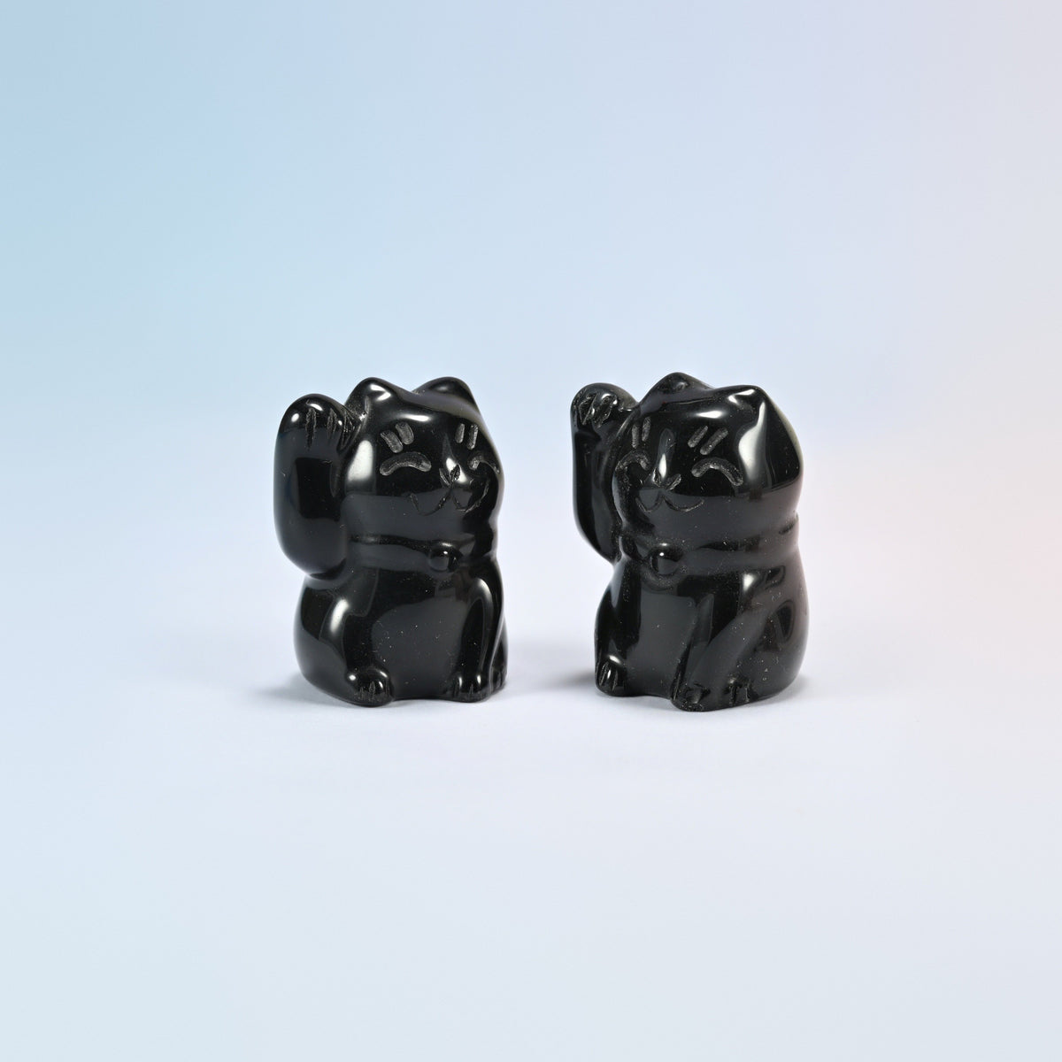 Two natural black obsidian waving cat crystal carvings, 1.8 inch, glossy black