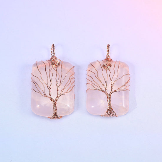 Rectangle Gemstone Tree of Life Pendant in blush pink stone, two pieces side by side with copper wire branches fanned across the polished face.
