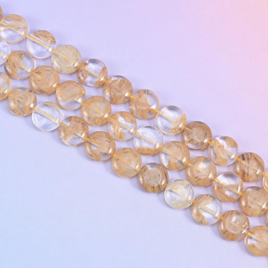 Yellow watermelon quartz beads in pale honey with golden-brown needle inclusions