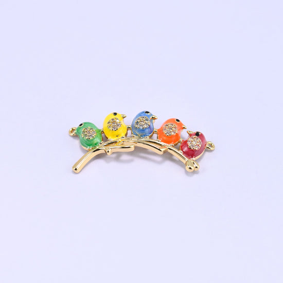 Five enamel birds lined up along a curved gold branch connector