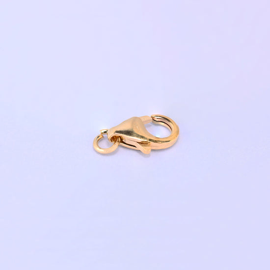 14K gold filled lobster clasp, 5x8.2mm, close-up of the trigger and hinge with the jump ring at the right