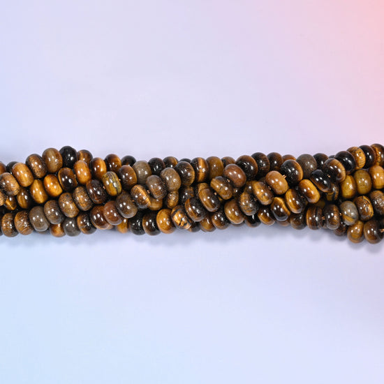 Natural Tiger's Eye rondelle beads in rich golden brown and deep chocolate tones with a chatoyant shine.