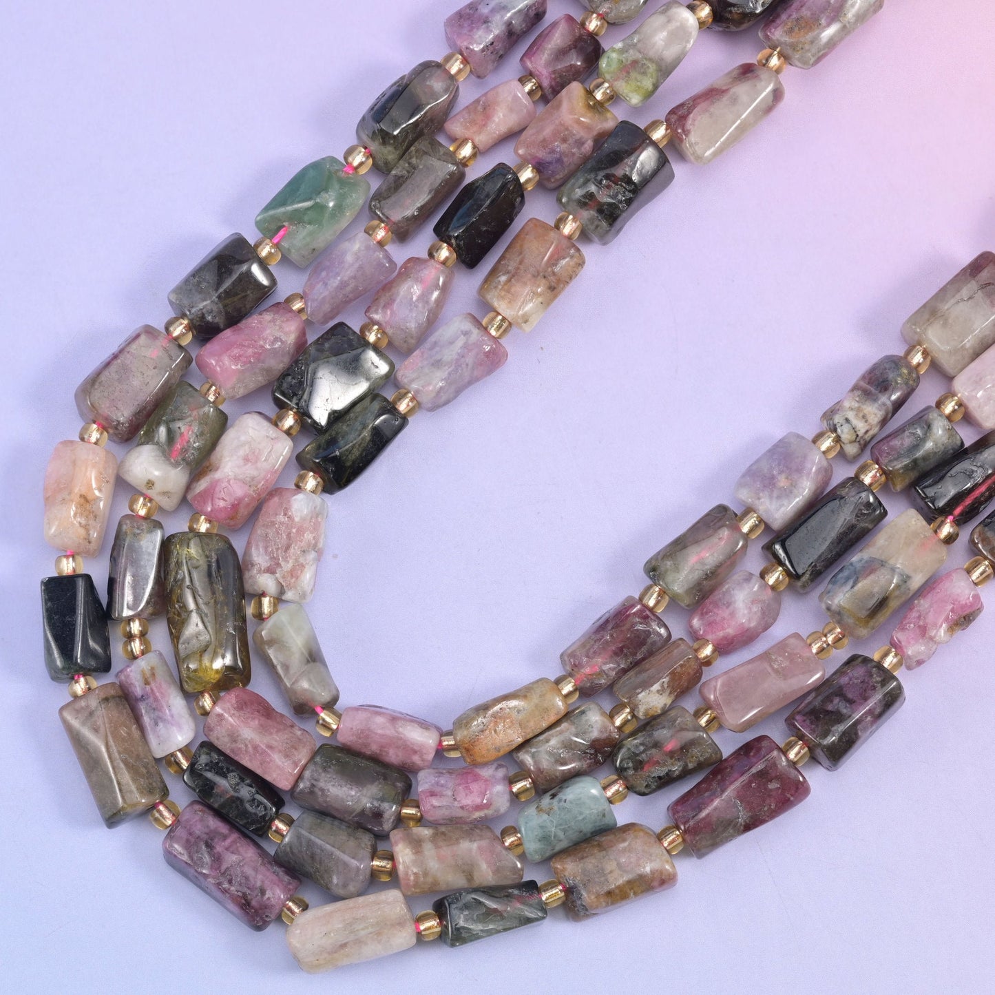Multi-Color Tourmaline irregular faceted tube beads, a luxurious gemstone with a sleek, modern silhouette