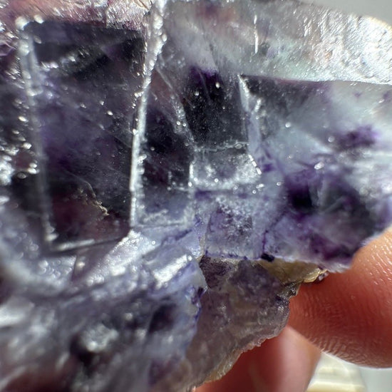 Macro detail of stacked Fluorite cubes with violet phantom edges
