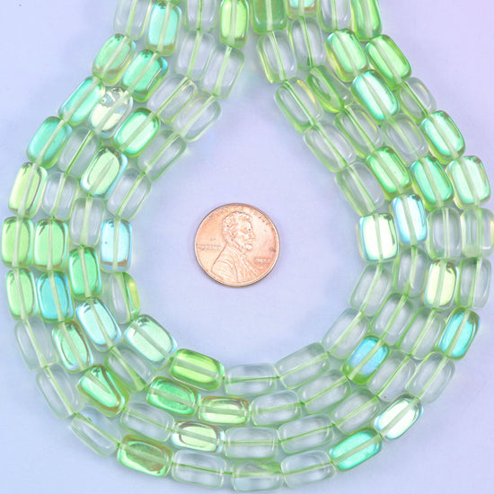 Green Mystic Aura glass beads in a rectangular cut with a glossy transparent finish, featuring a fresh lime-green shine with a subtle iridescent glow