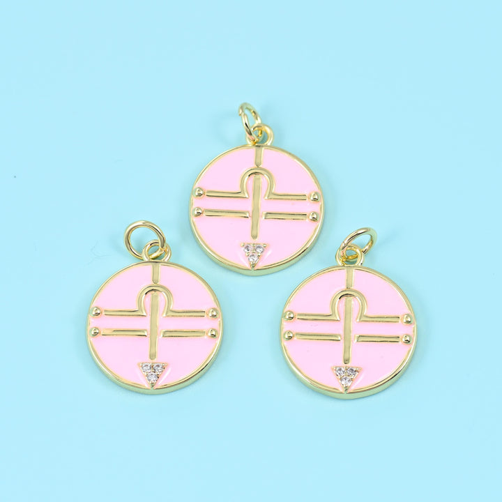 14K gold plated Libra zodiac charm, gold balance scale glyph with a zirconia triangle on a pink enamel disc, 15x15mm