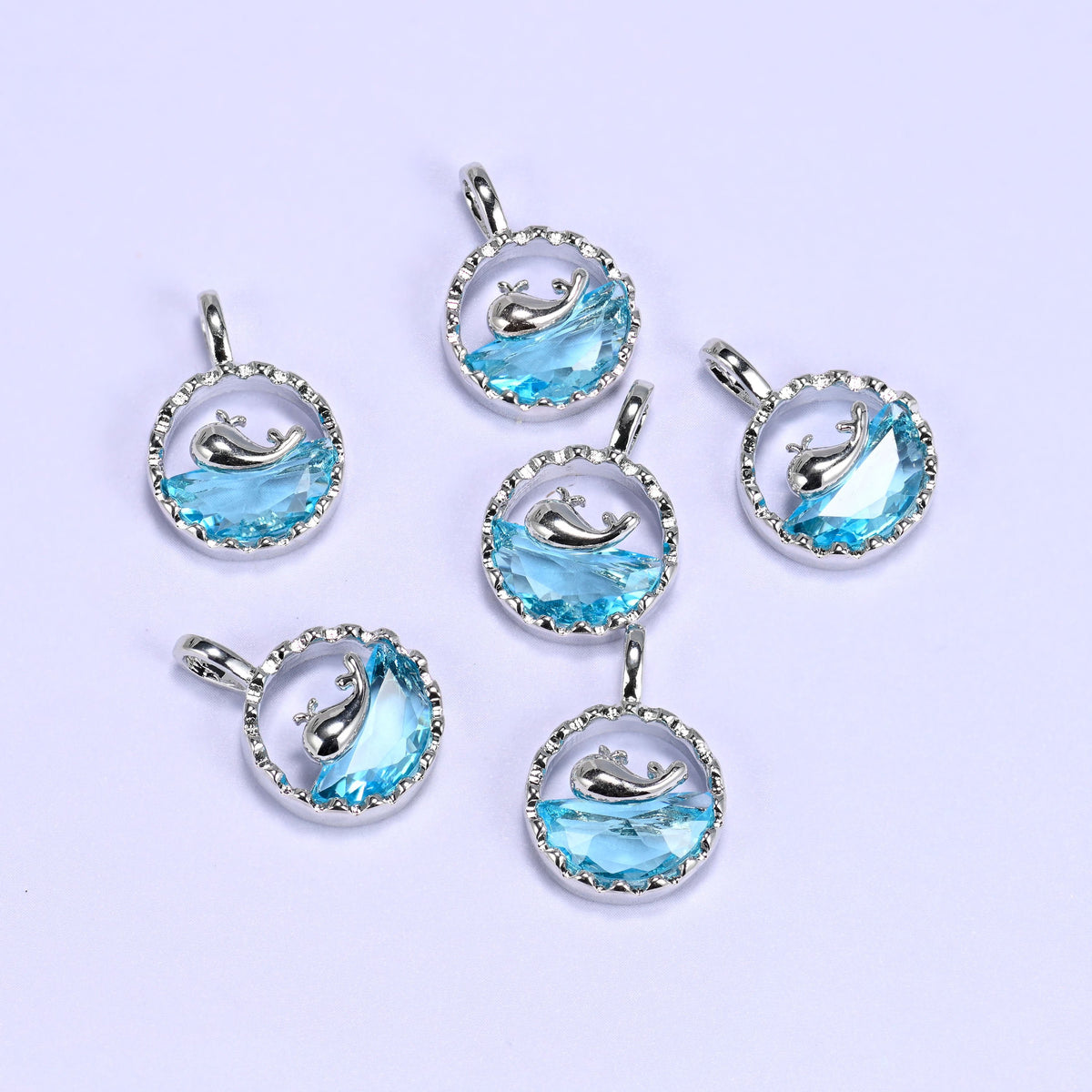 Textured round frame cut whale charm pendant