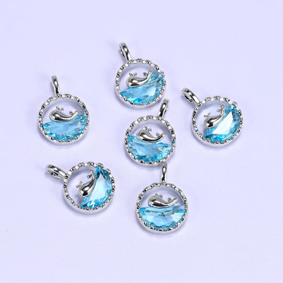 Textured round frame cut whale charm pendant