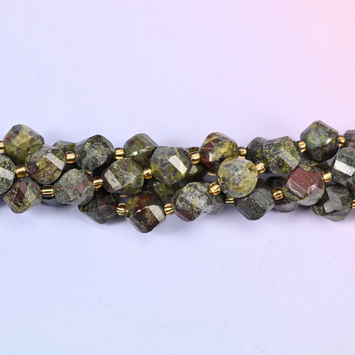 Dragon Bloodstone natural stone beads used as spacer or focal beads in handmade jewelry designs, 10mm