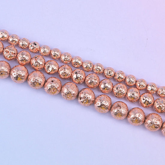 Volcano Rock Lava Beads with a deep pitted, sponge-like surface under the rose gold coating