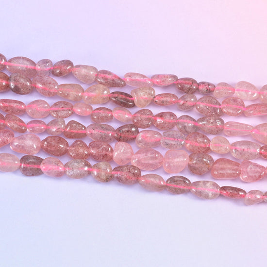 Strawberry Quartz Pebble Nugget Beads in translucent dusty rose with reddish-brown inclusions