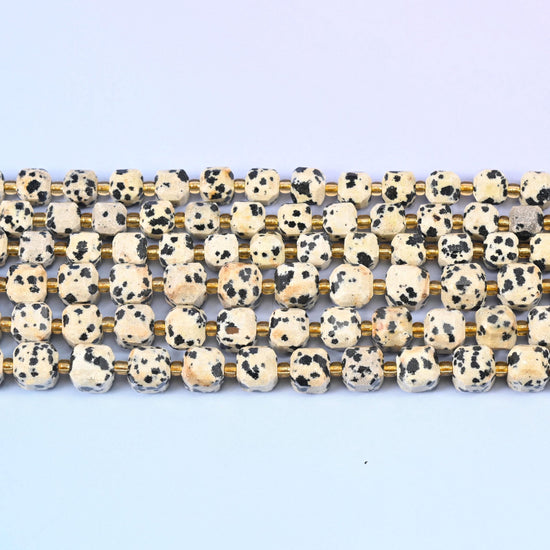 Dalmatian Jasper beads in bone-white and cream spotted with black